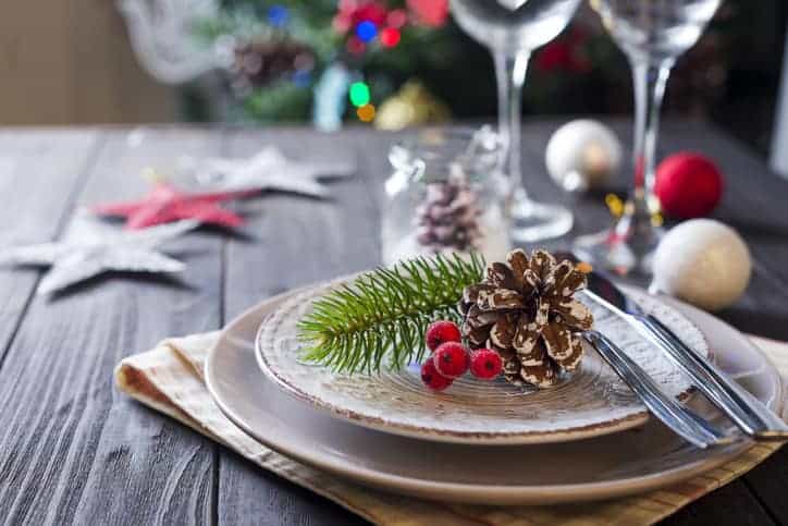 Table served for Christmas dinner Table served for Christmas dinner in living room, close up view