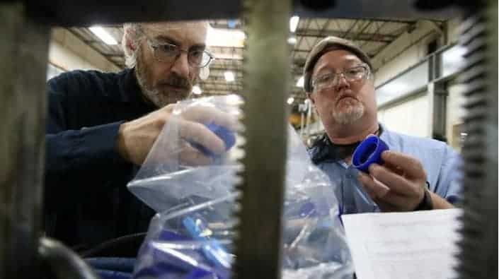 tony-ward-bob-leadingham Tony Ward, left, and Bob Leadingham inspect parts in the tool room at Hoffer Plastics on May 13, 2019 in South Elgin. The custom injection molding company shifted suppliers from China to other countries, such as Vietnam, after the first round of tariffs last year. (Stacey Wescott/Chicago Tribune)