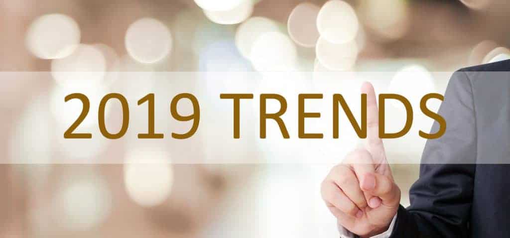 Businessman hand touching 2019 trend over blur office background, banner, 2019 business strategy annual plan, success in business concept Businessman hand touching 2019 trend over blur office background, banner, 2019 business strategy annual plan, success in business concept